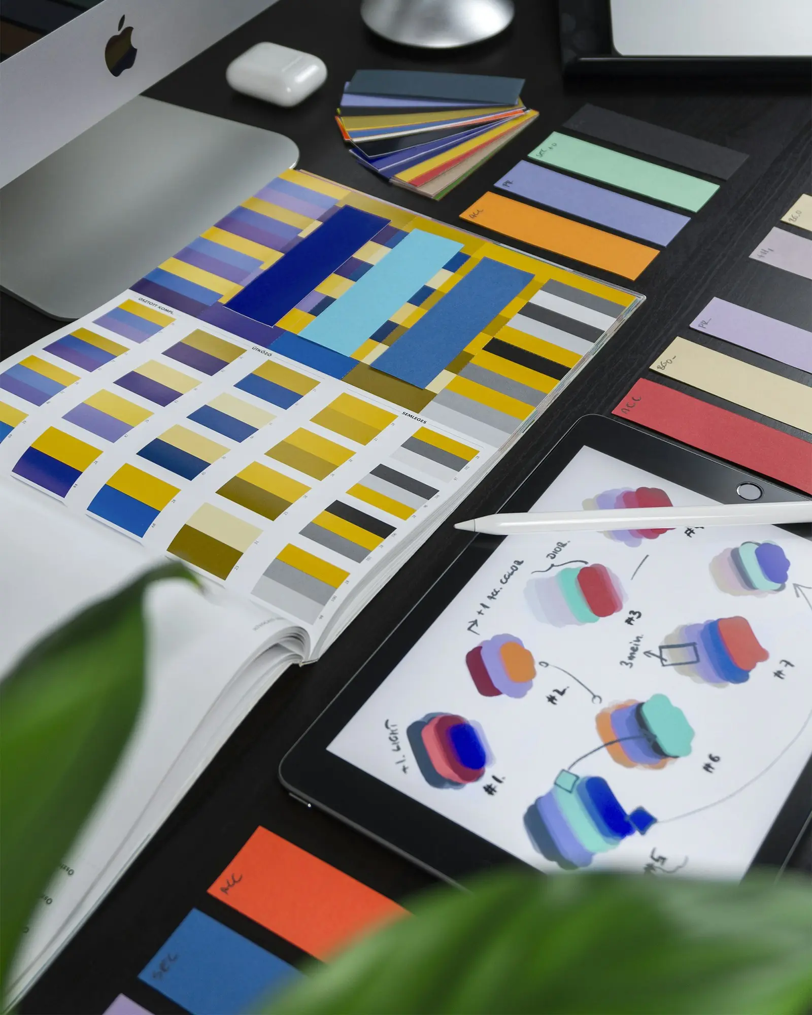 Designer working with colour palettes and brand swatches