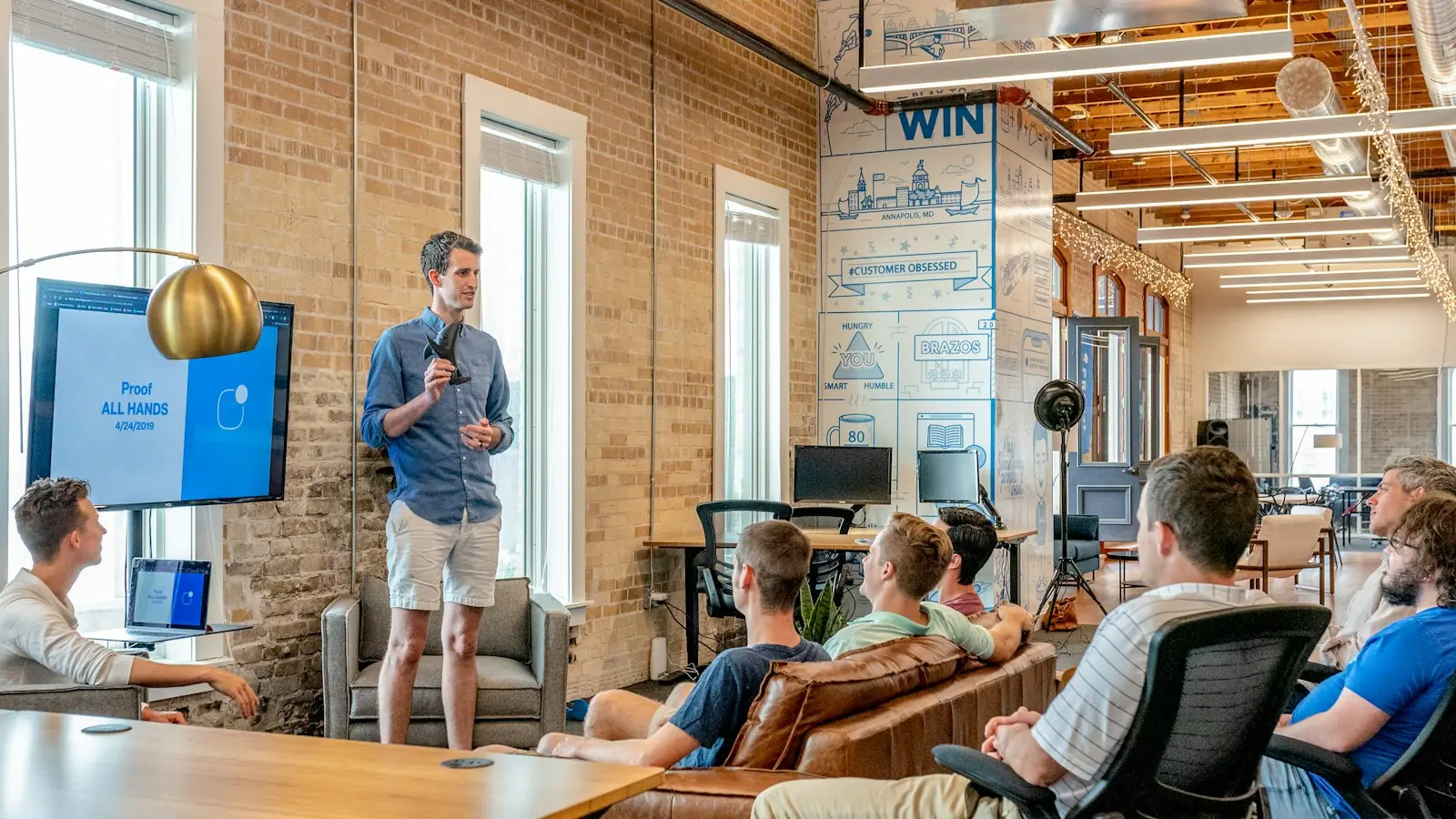 Team meeting and presentation in a modern office